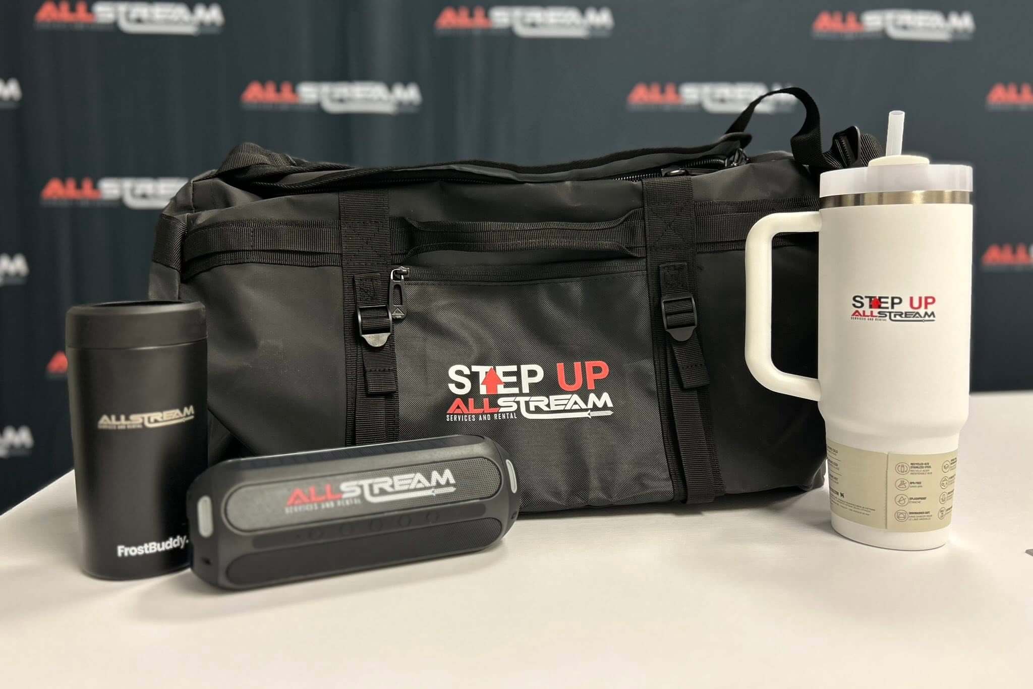 AllStream Step Up employee recognition gifts including branded duffel bag, drinkware and speaker